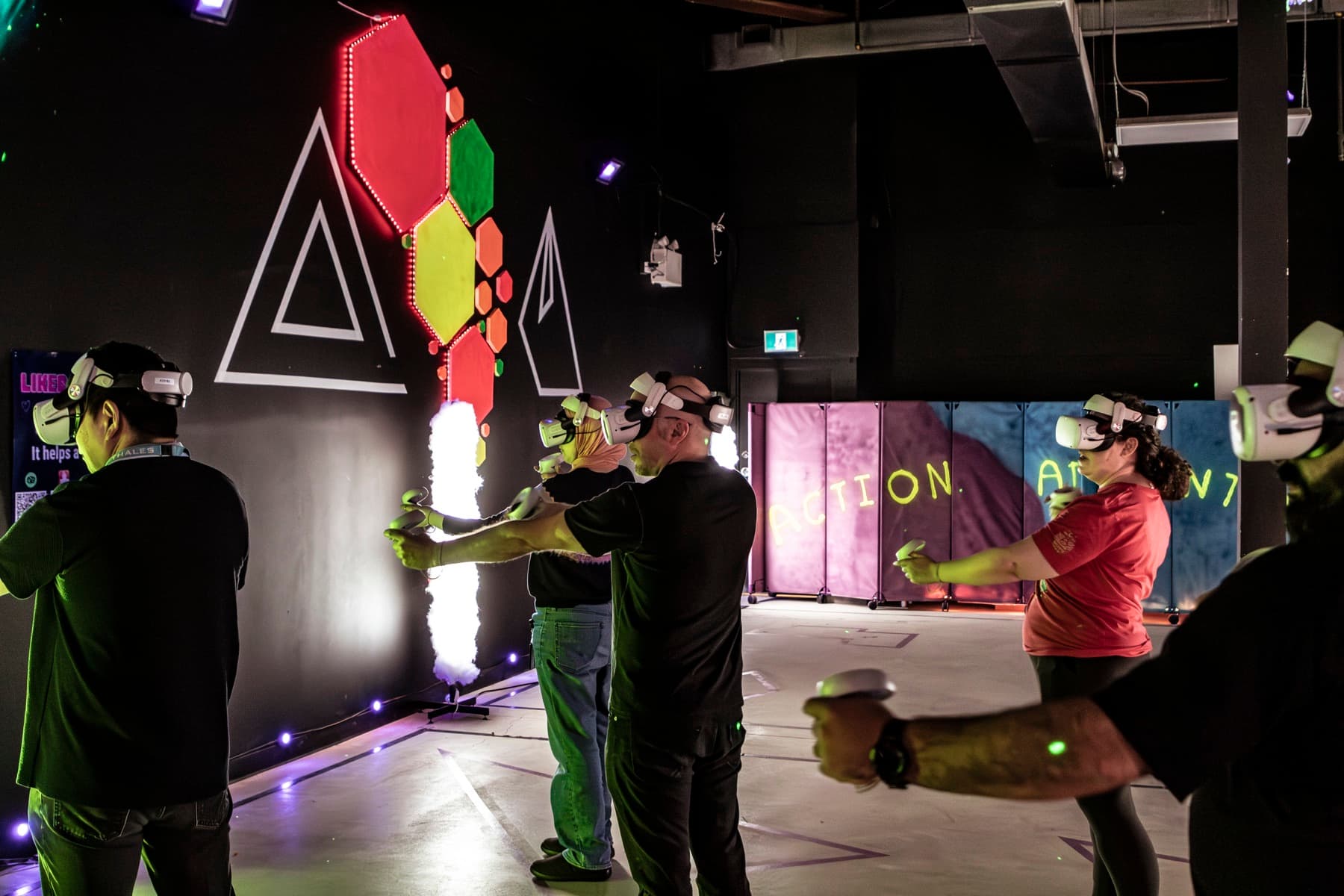 Guests playing a hosted VR team game at a company event