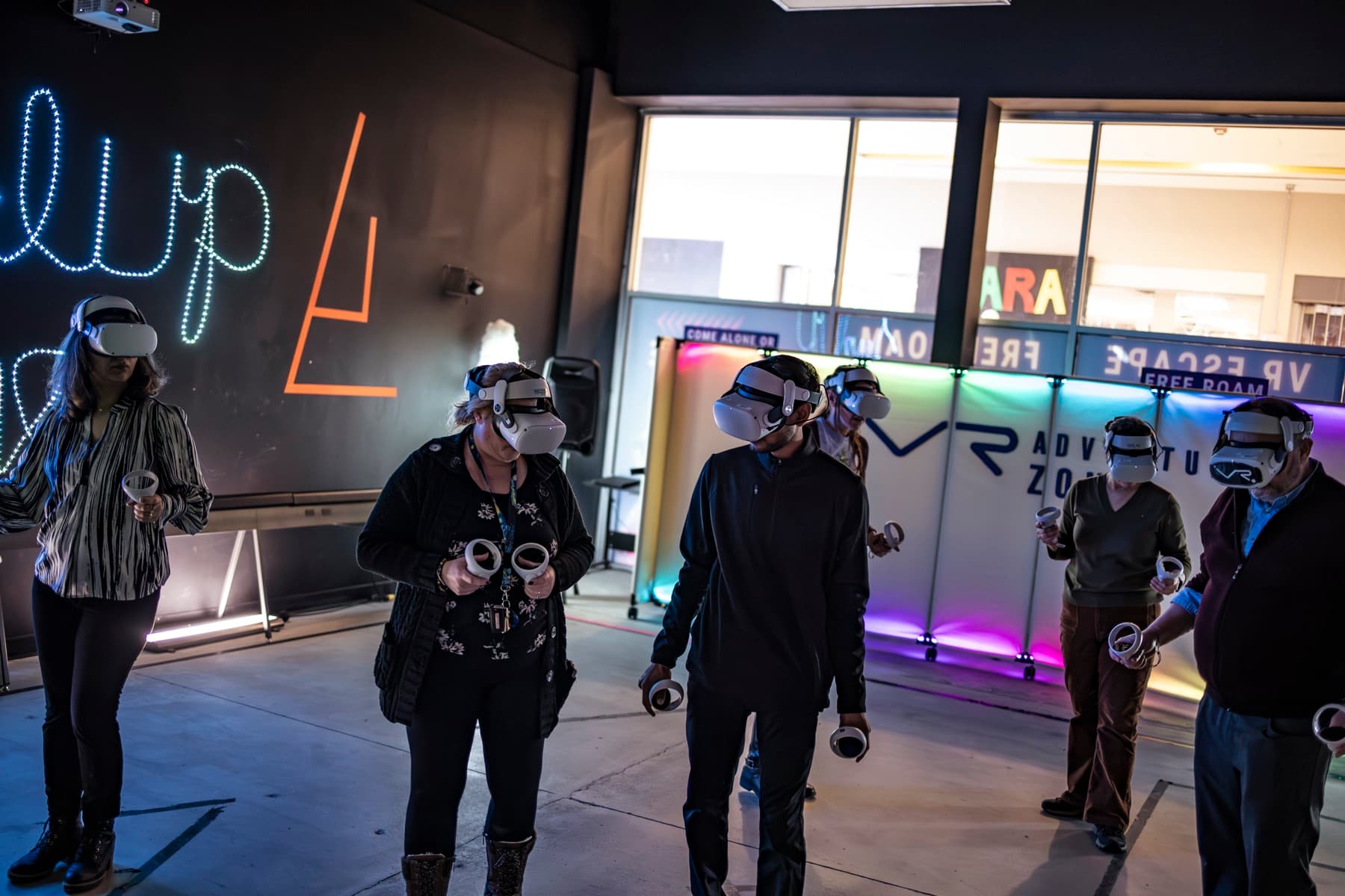 An office team in VR headsets at a hosted company event